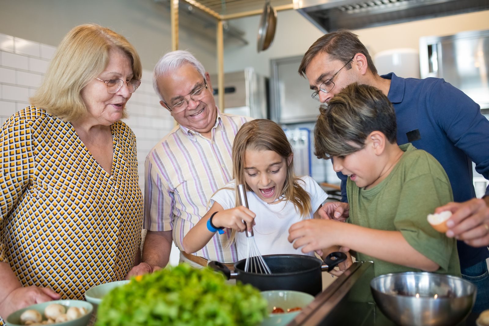 A family preparing a meal together in a home kitchen